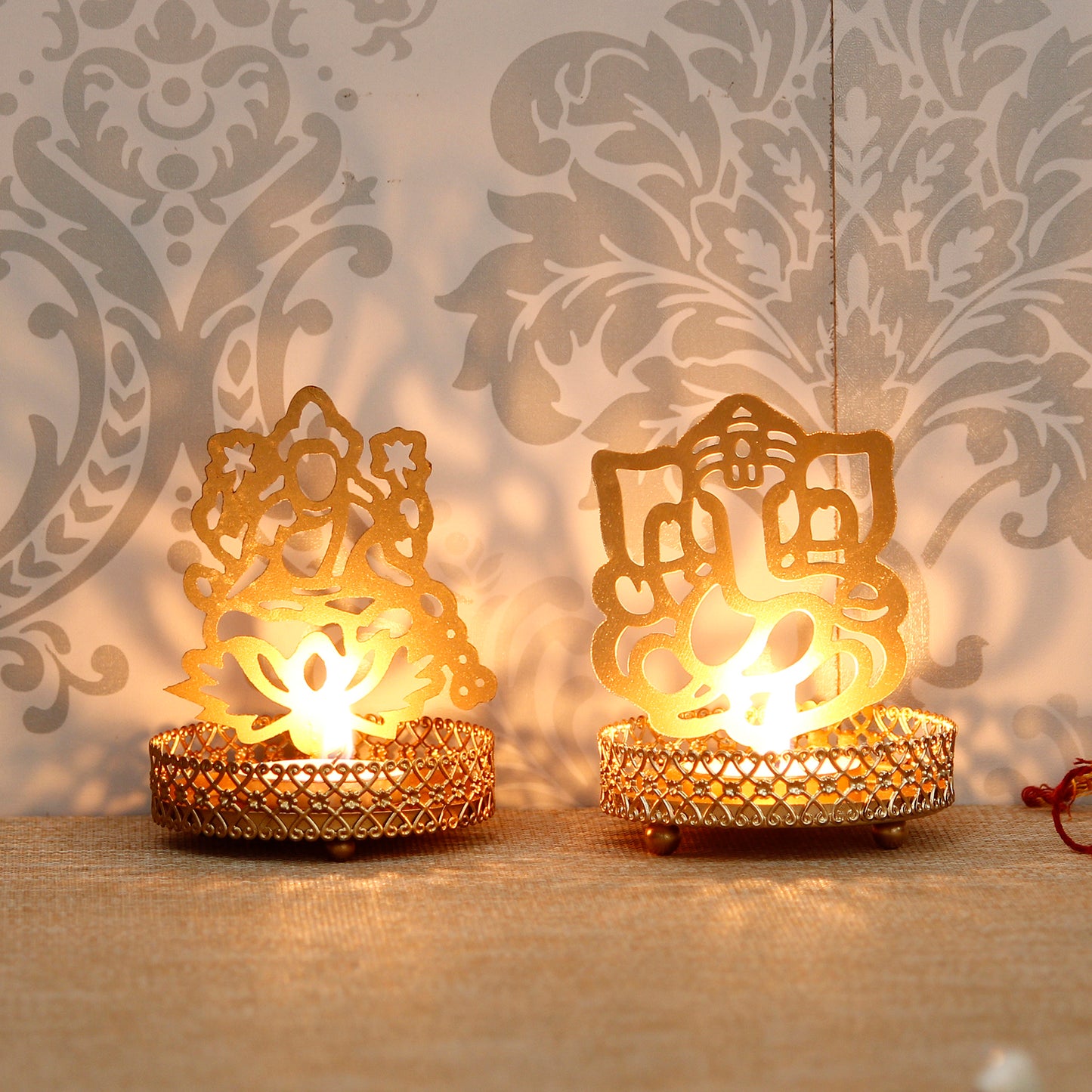 eCraftIndia Lord Ganesha and Laxmi Shadow Tea Light Holder LASATECH